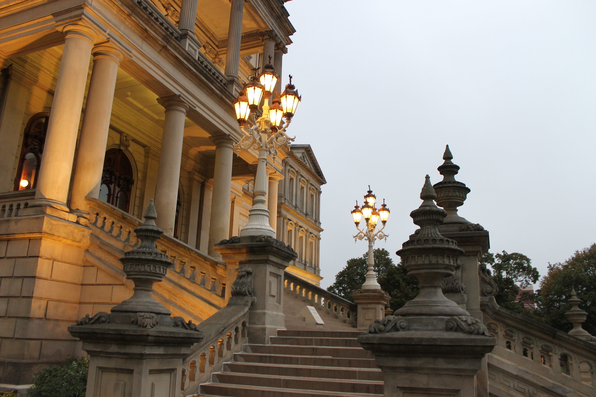 The steps of the Michigan Capitol building at dusk.